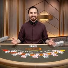 Dealer revealing cards during a live blackjack round
